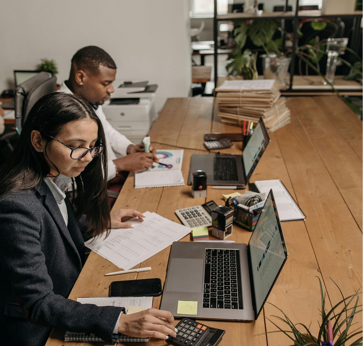 Accountants collaborating at a desk